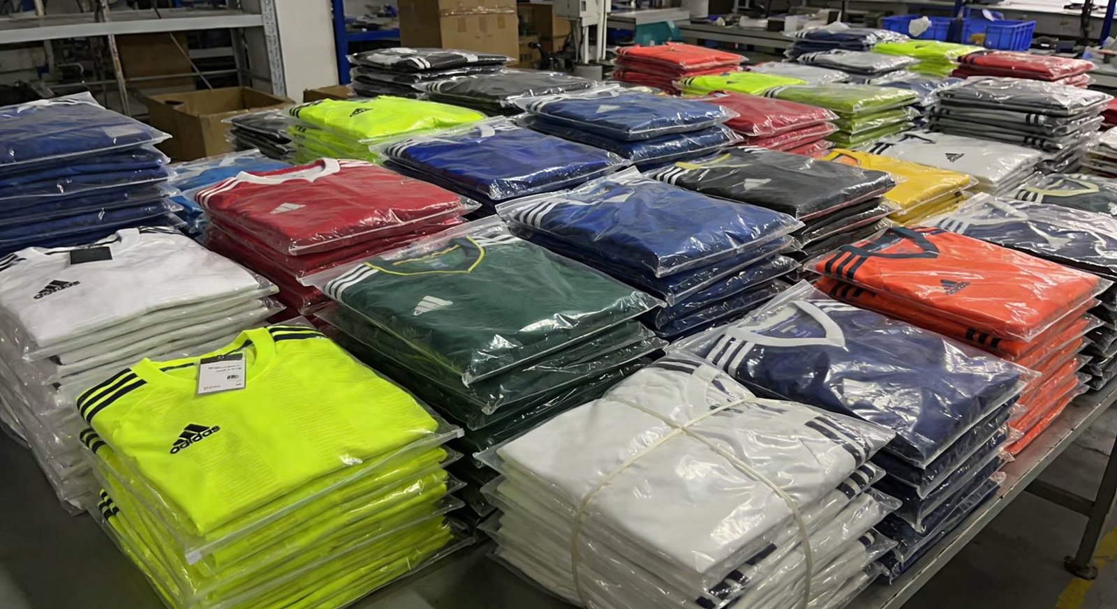 Bulk Custom Football Jerseys for OEM & Private Label Bulk custom football jerseys stacked for OEM and private label production
